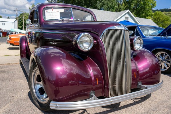 How do you choose between a new and used motorcycle for your first purchase?